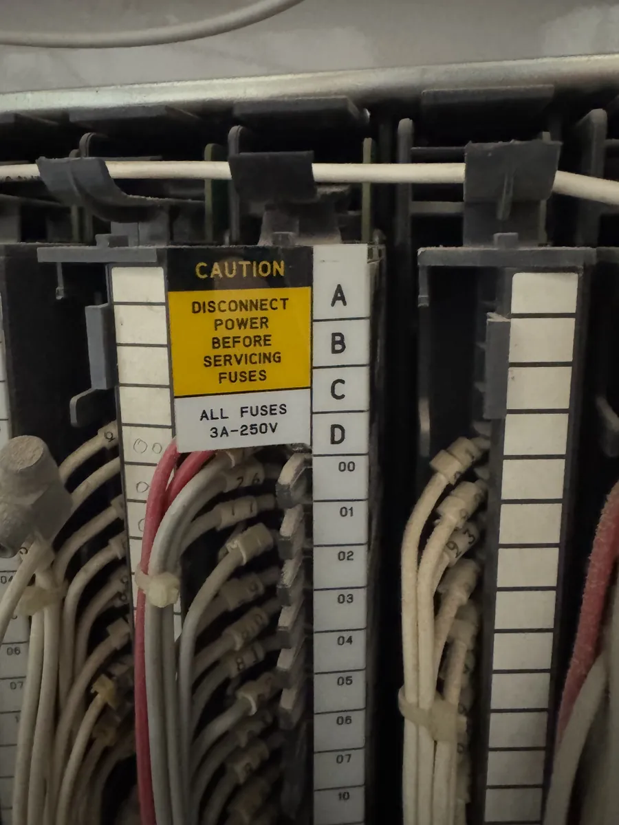 Fuse caution label on an output module
